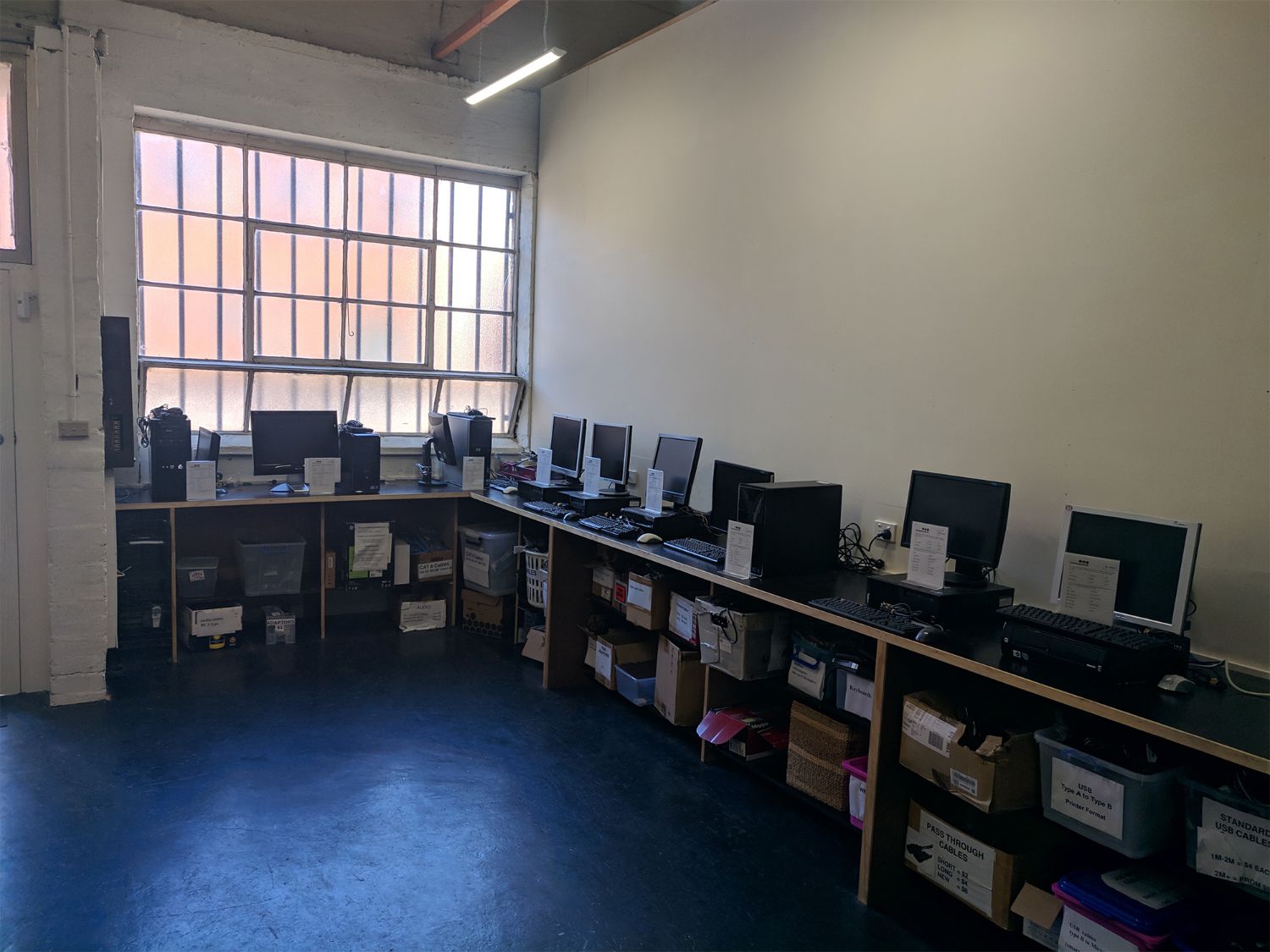 Workshop area with computers and parts